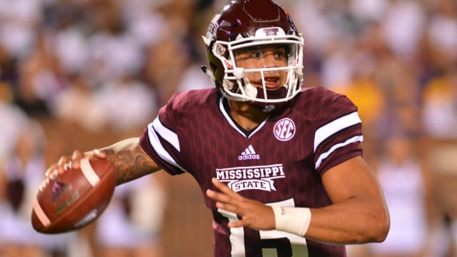 Mississippi State Bulldogs quarterback Dak Prescott (15) drops back to pass during the 2nd quarter of the game against the LSU Tigers at Davis Wade Stadium. 